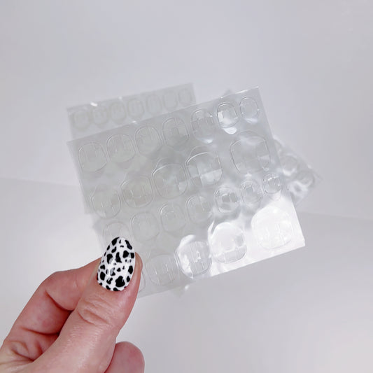 Replacement sheets of sticky gel tabs for safely and damage-free application of press-on nails. Ideal for ensuring a secure hold while protecting your natural nails, these high-quality adhesive tabs offer a reliable solution for effortless and long-lasting manicures at home.